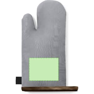 A grey kitchen mitten with a textured surface and a green rectangular patch, featuring a black hanging loop.