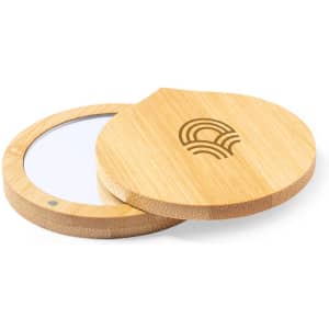 A bamboo pocket mirror with a circular design and a wooden cover, featuring a logo on top.