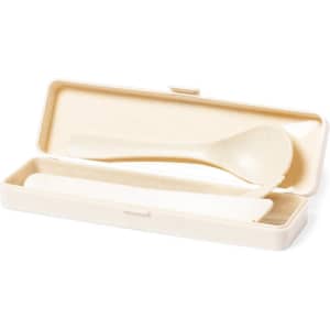 A cutlery set in an off-white case, including a spoon and knife. The case has a logo on it.