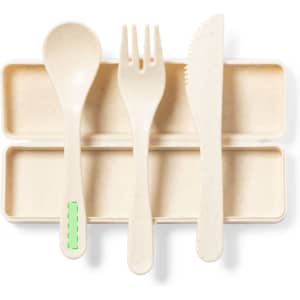 A cutlery set featuring a spoon, fork, and knife in a light beige shade, displayed on a matching case with a logo.