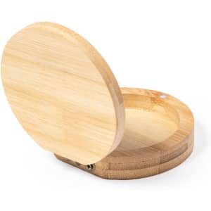 A bamboo jewellery wrap with a circular opening, featuring a smooth, natural finish and a simple design.