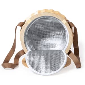 A round, tan thermal picnic basket with a silver insulated interior and brown straps. Features a simple logo.