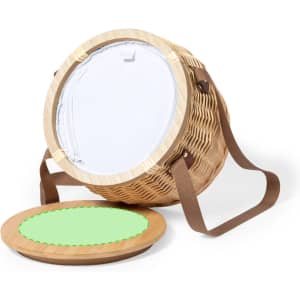 A woven thermal picnic basket in natural tones, featuring a brown strap and a removable green lid. Includes a branding logo.