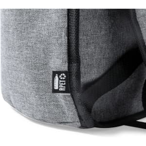 A grey cooler bag backpack with a textured surface and a branding label.