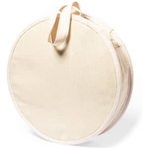 A round beige picnic bag with a zipper and a handle, designed for carrying picnic supplies.