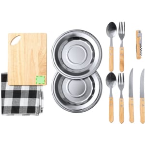A wooden cutting board, two stainless steel bowls, utensils with wooden handles, and a checkered cloth.