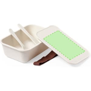 A cream-coloured lunch box with a brown strap, featuring two compartments and a lid, has a placeholder for a label.