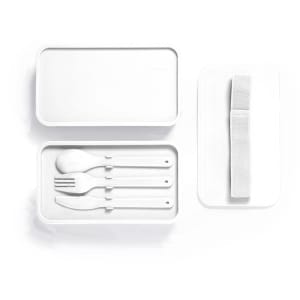 A white lunch box with a lid, containing a fork, knife, and spoon, plus a strap for closure.