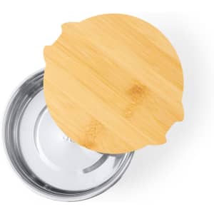 A stainless steel lunch box with a bamboo lid, featuring a circular design and smooth finish.