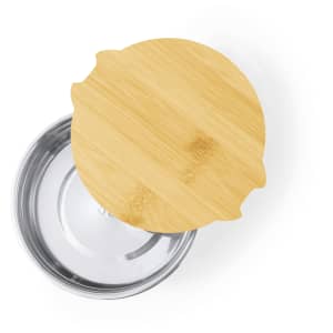 A bamboo lid rests atop a silver stainless steel lunch box, showcasing a sleek, modern design.