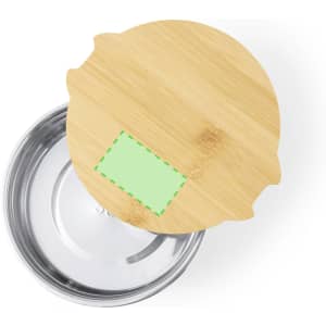 A bamboo lid atop a stainless steel container with a blank green label area, featuring a smooth, shiny interior.