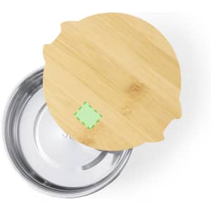 A round lunch box featuring a stainless steel interior and a bamboo lid. The lid has a green-highlighted area.
