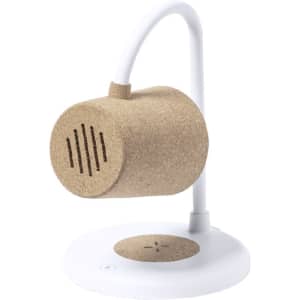 A multifunction lamp with a cork speaker, white lamp arm, and a wireless charging base in a modern design.
