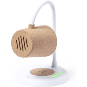 A multifunction lamp in cork and white, featuring a speaker and wireless charging base.