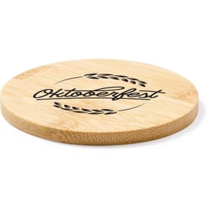A round bamboo coaster with a black logo design, featuring "Oktoberfest" and decorative elements.