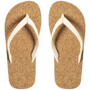A pair of brown cork flip flops with white straps. The design features a classic thong style and has a logo.
