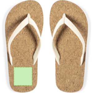 A pair of tan flip flops with white straps and a blank green square on the sole. Features a logo.