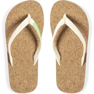 A pair of tan cork flip flops with white straps, featuring a small logo.