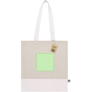 A light beige tote bag with a white bottom, featuring a green square and a tag. It has shoulder straps and a logo.