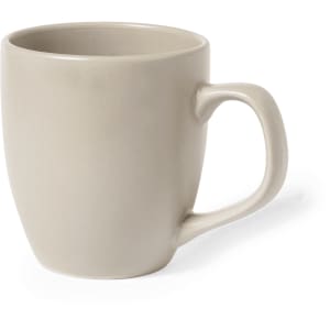 A coffee mug in a soft beige colour with a curved design and a comfortably shaped handle.