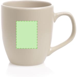 A coffee mug in a light beige colour with a blank area for custom designs. Features a handle and a rounded shape.
