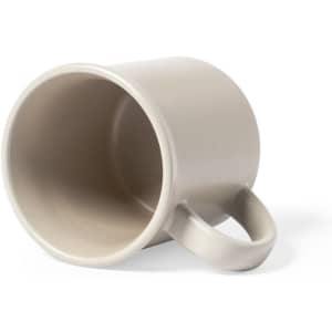A coffee mug in a light grey colour, featuring a simple design and a handle, with a logo visible.