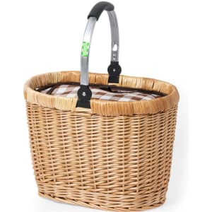 A woven wicker picnic basket with a metal handle and a checked fabric lining, featuring a natural colour palette.