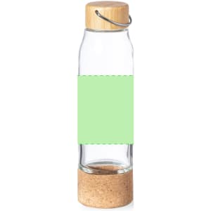 A drink bottle with a clear glass body, cork base, and a wooden lid, featuring a blank green label.