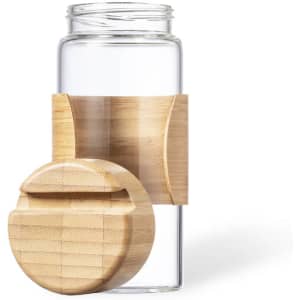 A drink bottle featuring a transparent glass body and a natural bamboo holder with a matching lid.