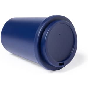 A blue insulated travel mug with a rounded design and a secure lid, featuring a logo.