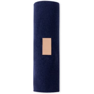 A rolled navy Kinar Scarf with a rectangular beige patch, featuring a logo.