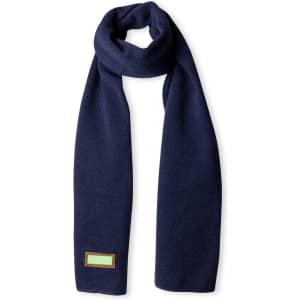 A navy Kinar scarf made of soft fabric with a small logo detail.