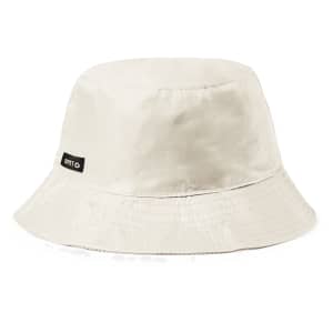 A beige reversible hat with a bucket style and a label. Suitable for headwear and outdoor activities.