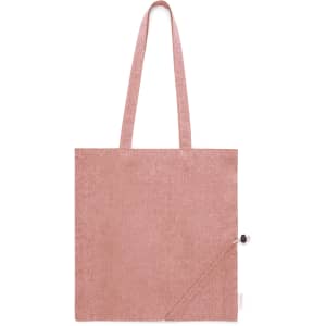 A foldable bag in a soft pink hue, featuring two long handles and a small side pocket with a button.