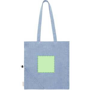 A foldable bag in light blue fabric with a green square on the front, featuring two sturdy handles and a logo.