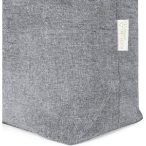 A grey tote bag with a textured fabric and a small logo tag indicating it is made from recycled materials.