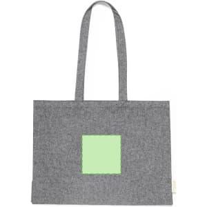 A grey tote bag with a green square patch and two handles. The bag features a logo on the side.