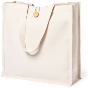 A cream tote bag with sturdy handles and a wooden button, featuring a simple design and no visible branding.