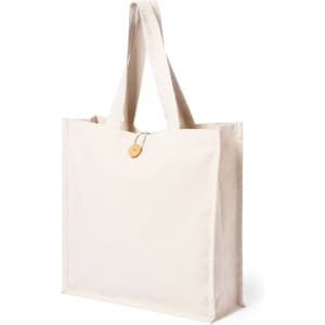 A cream tote bag with two sturdy handles and a decorative tag. It features a simple design and has a logo.