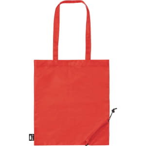 A red foldable reusable grocery bag with two handles and a zippered pocket. Includes a logo on the side.