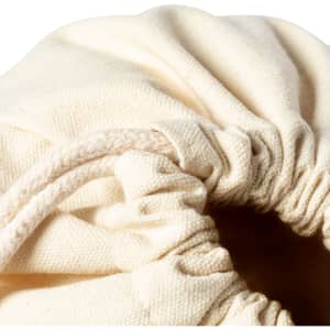 A cream-coloured drawstring bag with a gathered opening and a cord closure, featuring a simple design.