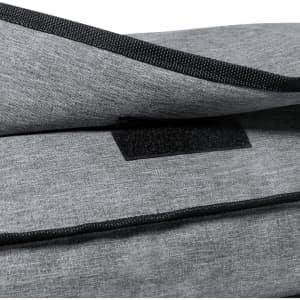 A grey satchel bag with a textured surface and a flap secured by Velcro. Features black edging and a logo.