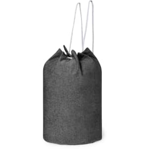 A grey drawstring bag with a textured fabric and white drawstrings, featuring a logo on the side.