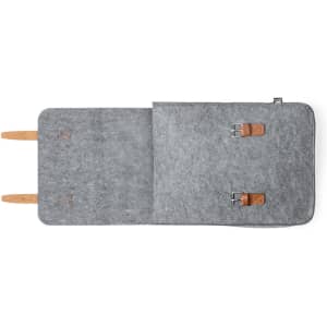 A grey felt backpack with brown leather straps and buckles, featuring a simple and minimalist design.