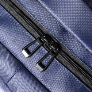 A navy blue backpack featuring a dual zipper closure and textured fabric design. It has a logo visible.