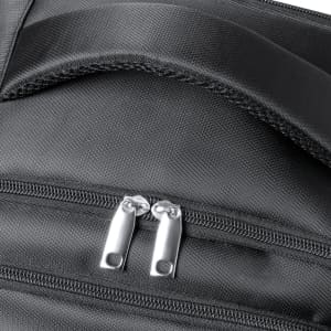 A close-up of a black backpack featuring dual silver zipper pulls and a textured fabric finish.