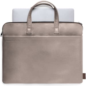 A taupe document bag featuring handles and a front pocket, with a laptop partially visible inside. It has a logo.