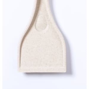 A light cream-coloured ice scraper with a flat, wide blade and a curved handle. It has a logo on the handle.