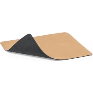 A mousepad with a smooth tan surface and a textured black underside, featuring a logo.
