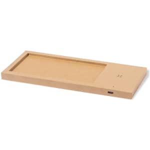 A rectangular brown organiser charger with a designated area for devices and a charging port on one side.